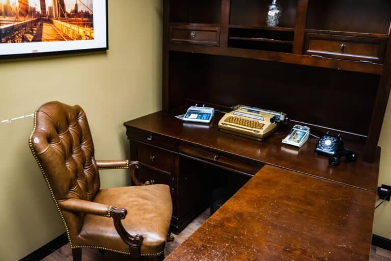 Image of the Mob Boss escape room Frederick MD at Escape This Frederick. Looking at a desk with old furniture.